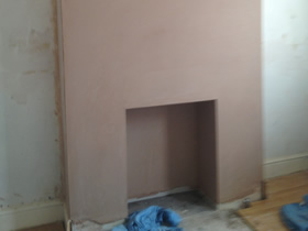 plastered_a_breast_wall_and_ceiling_panel_underneath_staircase thumbnail